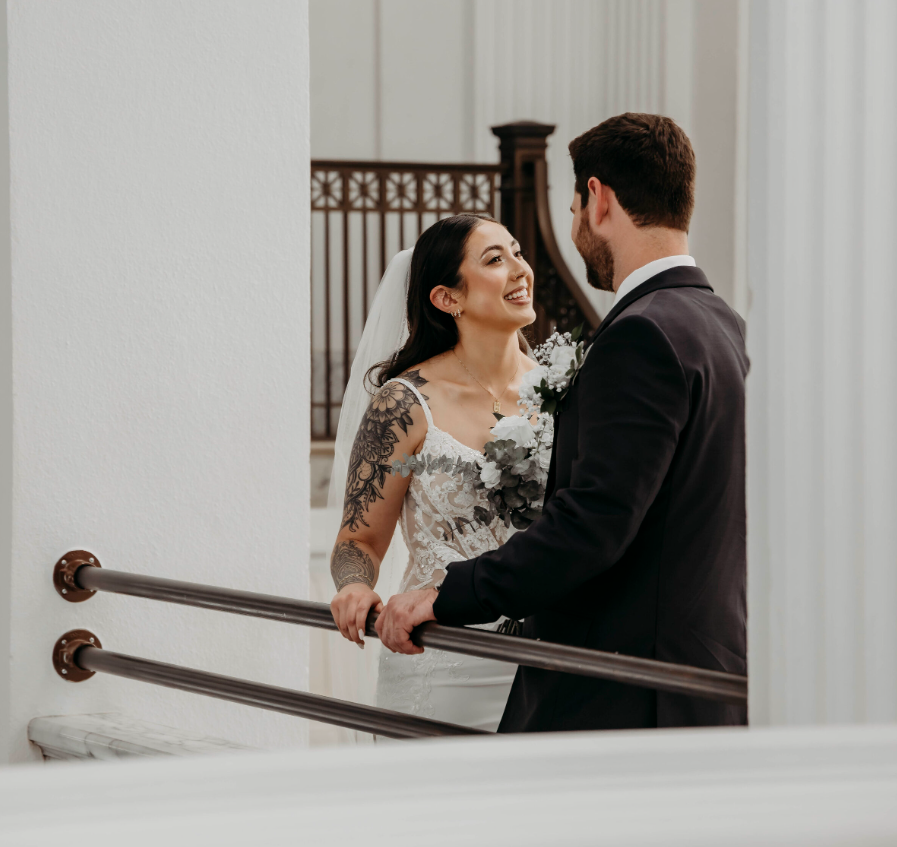 Bride and groom sharing a moment before walking down the aisle