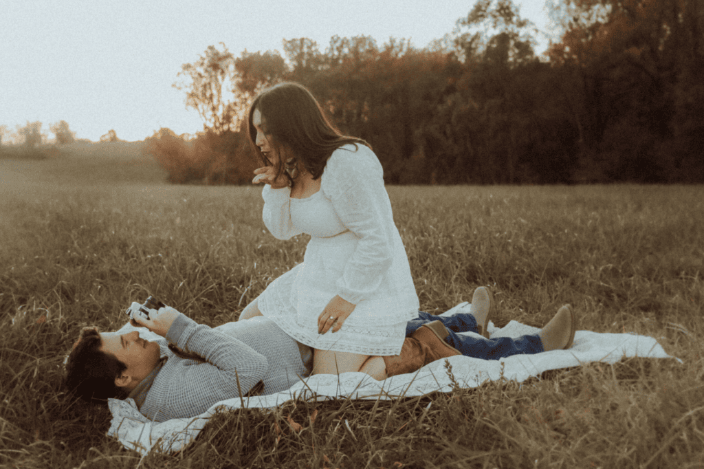Couple in a fall field during a couples photography session