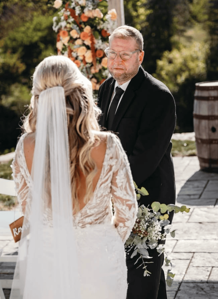 Emotional father-daughter moment at wedding ceremony