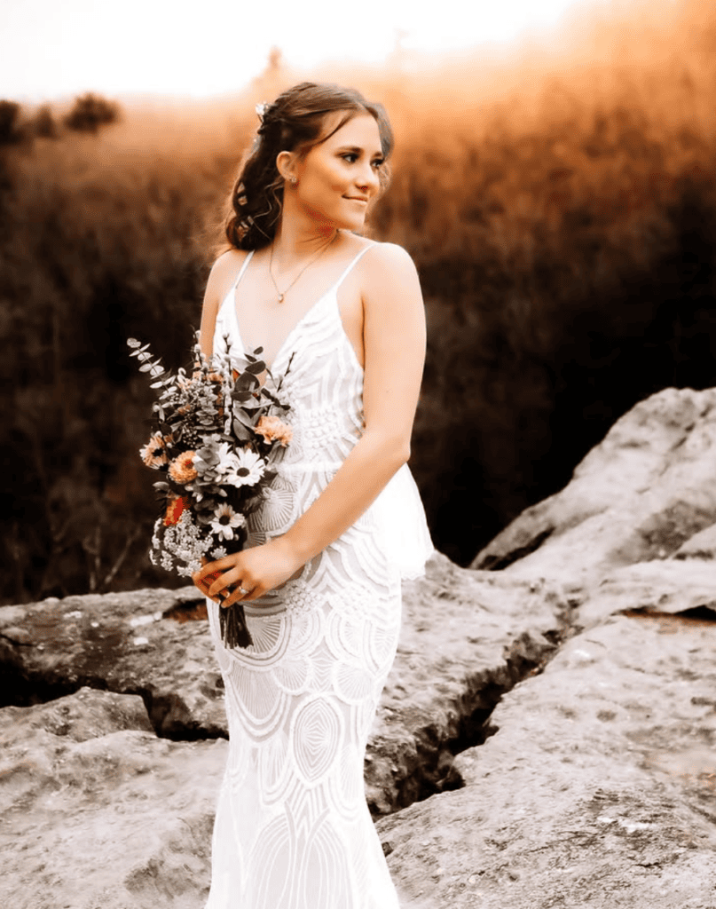 destination elopement portrait of bride on sunset cliff