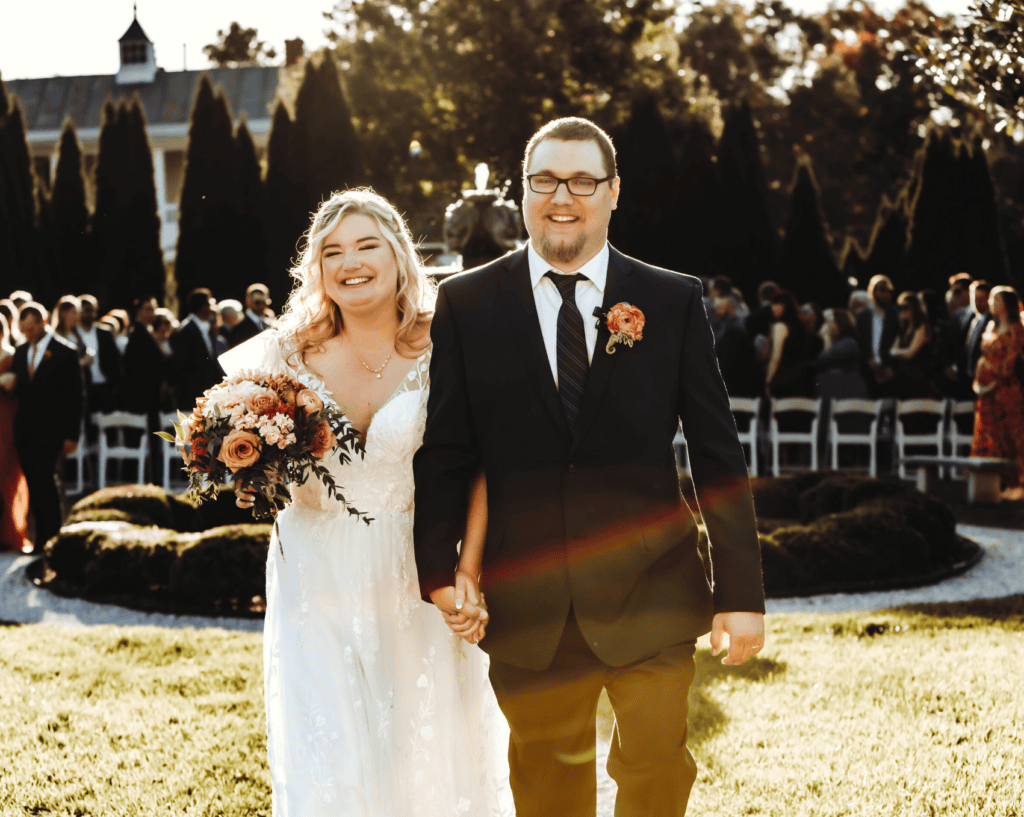 bride and groom walking through the isle after wedding ceremony